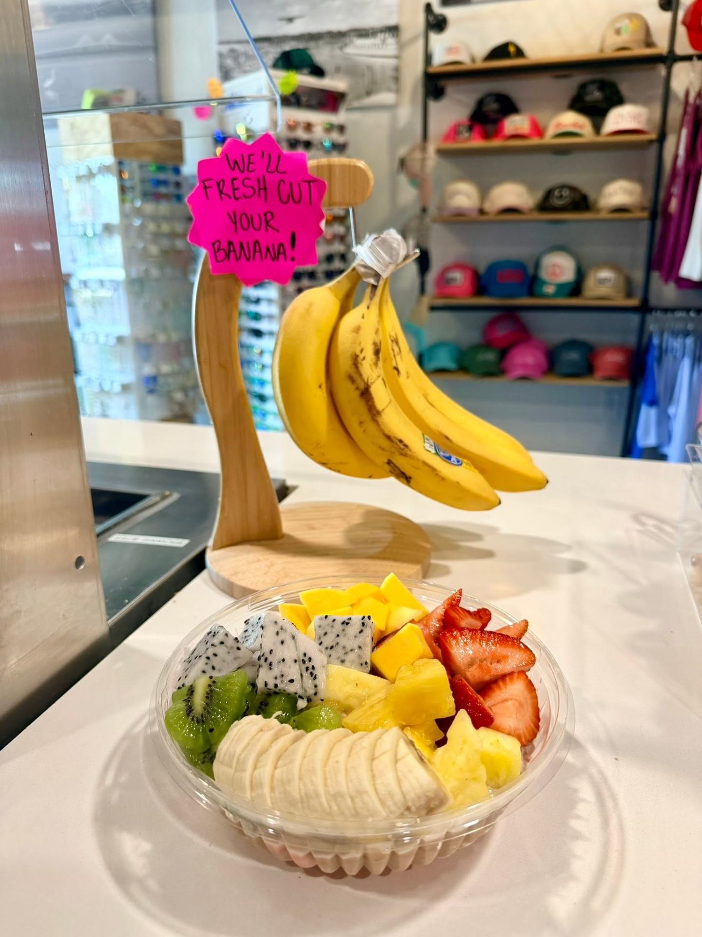 Fresh tropical fruit bowl with kiwi, dragon fruit, mango, strawberry and pineapple at AMI FroYo